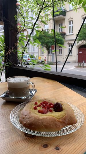 cappuccino and vegan bun at Wypas in Poznan