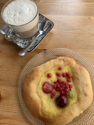cappuccino and vegan bun at Wypas in Poznan