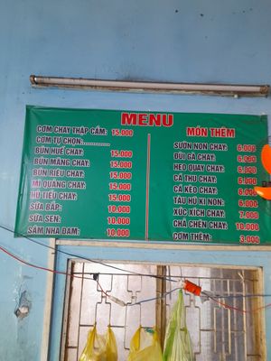 Menu on the wall in Vietnamese only at Com chay Vạn Duyen in Ho Chi Minh City