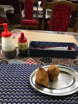 Appetizer fresh samosa with green and tamarind chutneys at Kusum Indian Restaurant in Kobe