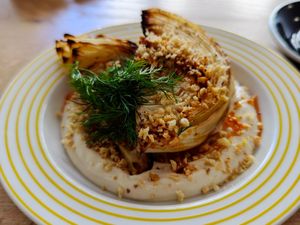 Grilled cabbage on a hummus bed at Ziomal in Poznan