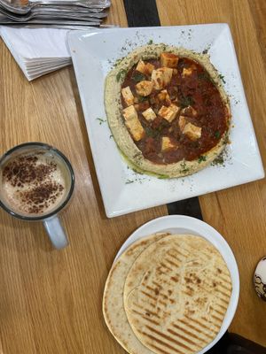 delicious vegetable shakshuka with tofu on top of hummus  at Cafe Ole  in Philadelphia