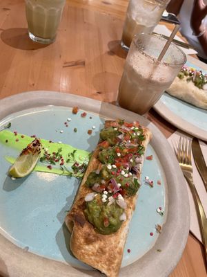 Big Breakie Vegan Burrito + iced chai latte with oat milk  at Brunch & Cake in Barcelona