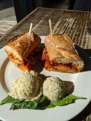 Buffalo chicken sandwich plate with potato salad at Two Mammas Vegan Kitchen in Oakland