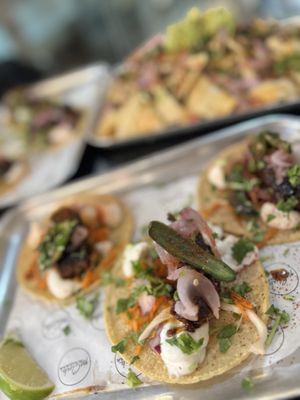 Ribs Tacos (and a full tray of nachos blurry in the back)  at Club Mexicana in West London