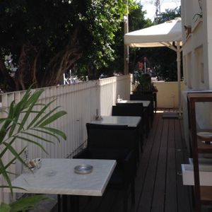 Outdoor seating at Lechem Erez in Kfar Saba