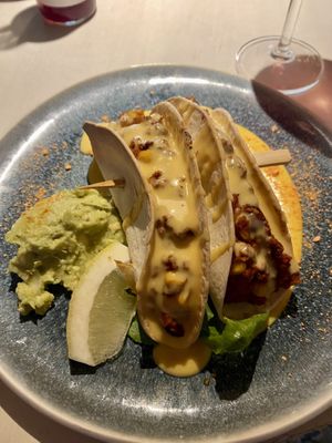 Spicy oven-baked seitan tacos with sheese and guacamole   at Vegan Restoran V in Tallinn