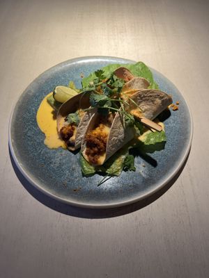 Spicy oven-baked seitan tacos with sheese and guacamole  at Vegan Restoran V in Tallinn