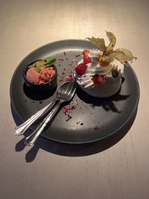 Meringue with passion fruit filling and vegan strawberry ice cream  at Vegan Restoran V in Tallinn