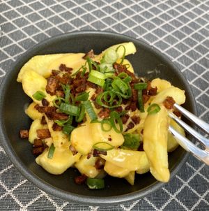 Fries with cheese sauce and smoked tofu   at Vegan Restoran V in Tallinn