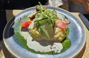 Baked sweet potato with quinoa, crispy tempeh, guacamole and mango sauce at Vegan Restoran V in Tallinn