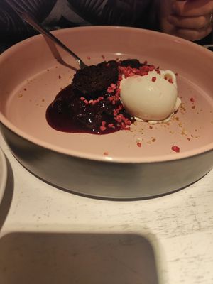 Brownie with white chocolate ice cream and cherry compote at Vegan Restoran V in Tallinn