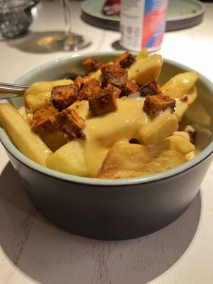 fries with vegan cheese sauce and tofu bites  at Vegan Restoran V in Tallinn