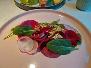 Beetroot ravioli with cashew cream sheese and basil pesto  at Vegan Restoran V in Tallinn