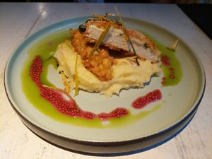 Breaded ‘chicken’ with herb sheese, potato puree, sun-dried tomato sauce and pickles at Vegan Restoran V in Tallinn