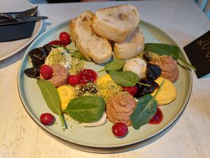 Selection of spreads: Classic pâté, feta cream, olive tapenade, nuts, sheese cubes and garlic bread at Vegan Restoran V in Tallinn