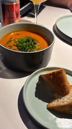 Tomato and bell pepper puree soup with olive focaccia and crispy chickpeas at Vegan Restoran V in Tallinn