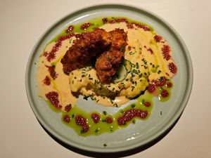 Mati's breaded chickenless fillet with herb sheese, potato puree and sun-dried tomato sauce at Vegan Restoran V in Tallinn