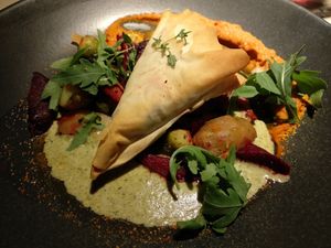 Special of the day: chanterelle mushroom filo pie on roasted vegetables and a moreish sun-dried tomato hummus. at Vegan Restoran V in Tallinn