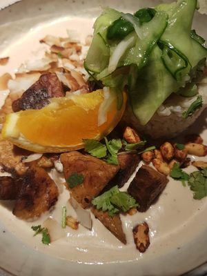 Tempeh with brown basmati rice and coconut-peanut sauce at Vegan Restoran V in Tallinn