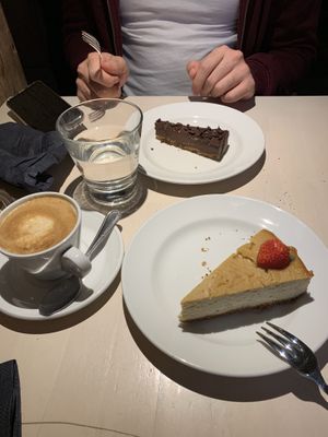Rich chocolate cake & baked tofu cake + cappuccino  at Vegan Restoran V in Tallinn