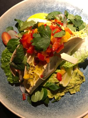 Spicy oven-baked seitan tacos with cheese, guacamole and mango salsa   at Vegan Restoran V in Tallinn