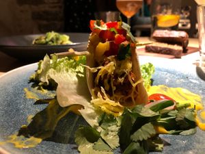Spicy oven-baked seitan tacos with cheese, guacamole and mango salsa  at Vegan Restoran V in Tallinn