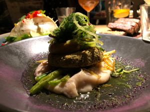 Fish cutlet“ with smoky carrot cream, cauliflower sunroot puree and warm salad at Vegan Restoran V in Tallinn