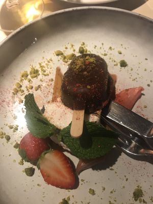 Strawberry cheese cake with marshmallow thingi, sparkling wine marinated rhubarb and pistachios! at Vegan Restoran V in Tallinn