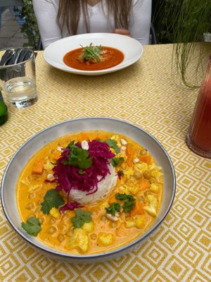 Chickpea, sweet potato and cauliflower coconut curry - Smoky tomato and cheese puree soup with vegan parmesan at Vegan Restoran V in Tallinn