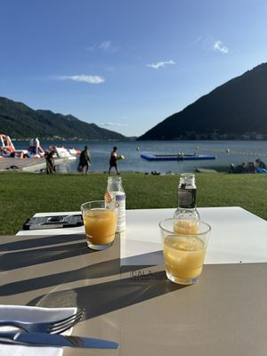 The view of Lake Lagano from the outdoor seating   at CALA Melide in Lugano