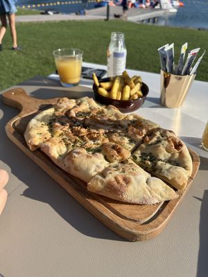 Rosemary and oil focaccia bread and French fries  at CALA Melide in Lugano