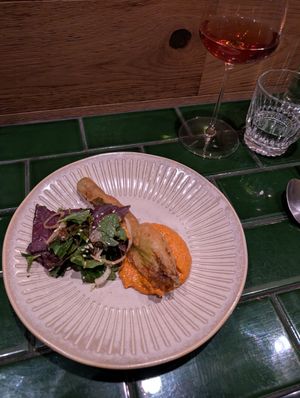 Half serve almond ricotta stuffed zucchini flower red pepper romesco at HUMBUG in Newcastle