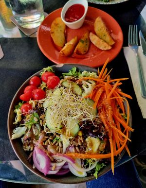 Lentil salad with potato wedges. at Temple Natura in Mallorca
