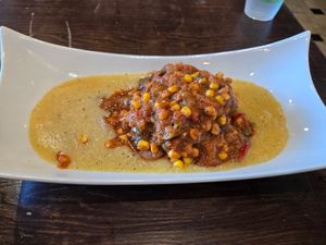 Southern staples bowl, grits and gumbo over fried tofu. Delicious!! at Souley Vegan in Oakland