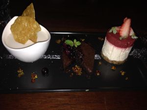 Trio of dessert: strawberry cheesecake, coconut/kaffir lime blancmange, chocolate brownie. at Vivo Bar and Grill in Palm Cove