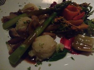 Absolutely delicious main course of truffle mashed potato, braised onion and mushrooms, and a tomato and asparagus salad at Gare du Nord in Rotterdam