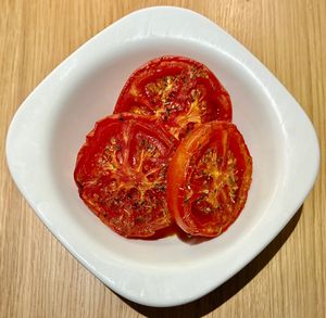 Herb roasted tomatoes  at Novotel Bucharest City Centre Breakfast Restaurant  in Bucharest