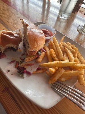 Half eaten vegan chicken sandwich   at Tiny's Coffee Bar in Gary