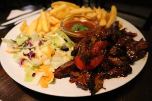 Seitan BBQ sauce steak, really good!!  at Kozmosz Vegan Etterem in Budapest