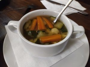 Daily soup - broth with veggies 🥣 at Kozmosz Vegan Etterem in Budapest