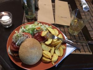 Veggie burger and apple cider at Kozmosz Vegan Etterem in Budapest