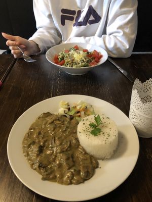 Mushroom curry and spinach pasta  at Kozmosz Vegan Etterem in Budapest
