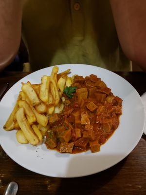 Seitan stew with fries at Kozmosz Vegan Etterem in Budapest