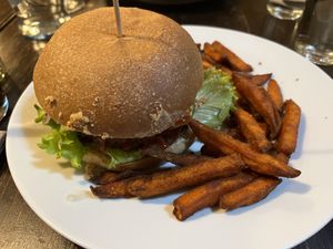 Bean burger with sweet potato fries  at Kozmosz Vegan Etterem in Budapest