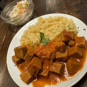 Seitan stew with spaetzl type noodles    at Kozmosz Vegan Etterem in Budapest