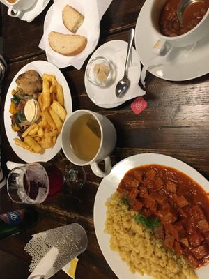 Goulash soup, homemade bread, seitan stew, and oven-baked veggie plate  at Kozmosz Vegan Etterem in Budapest