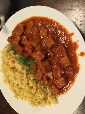 Traditional Hungarian stew with homemade seitan and nokedli  at Kozmosz Vegan Etterem in Budapest