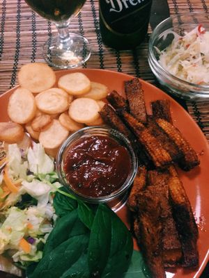 BBQ seitan stripes with Hungarian pickles and beer  at Kozmosz Vegan Etterem in Budapest