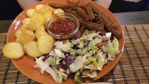 Seitan with salad and potatoes at Kozmosz Vegan Etterem in Budapest